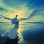 Woman in White Watching Ocean